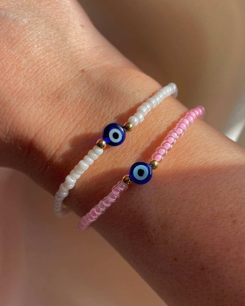 CALEY | tiny beaded bracelet with blue evil eye